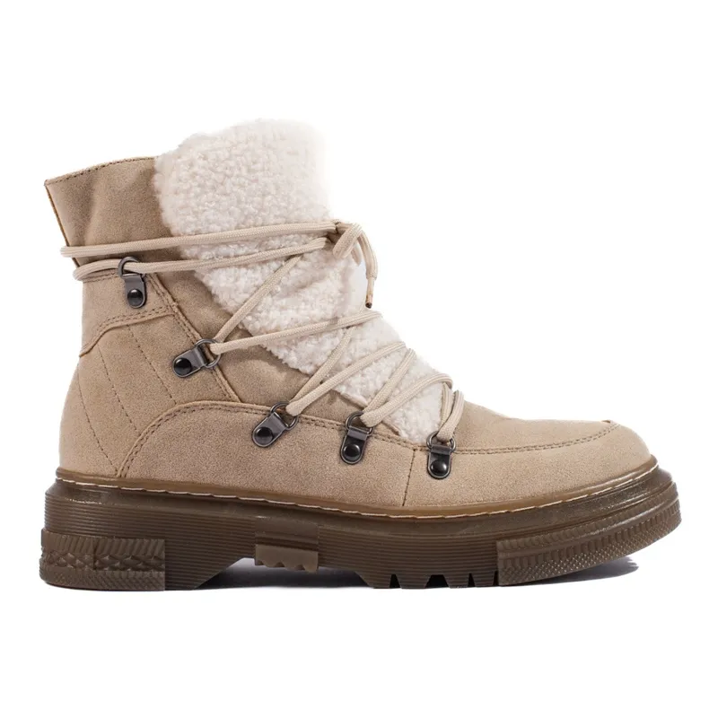 Women's beige snow boots with a sheepskin coat