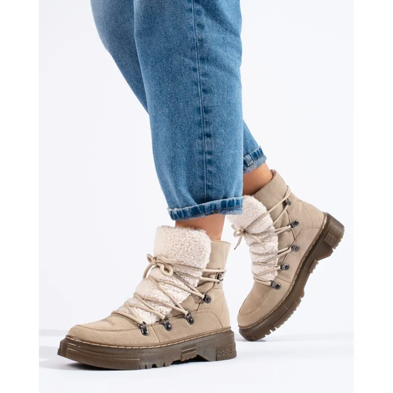 Women's beige snow boots with a sheepskin coat